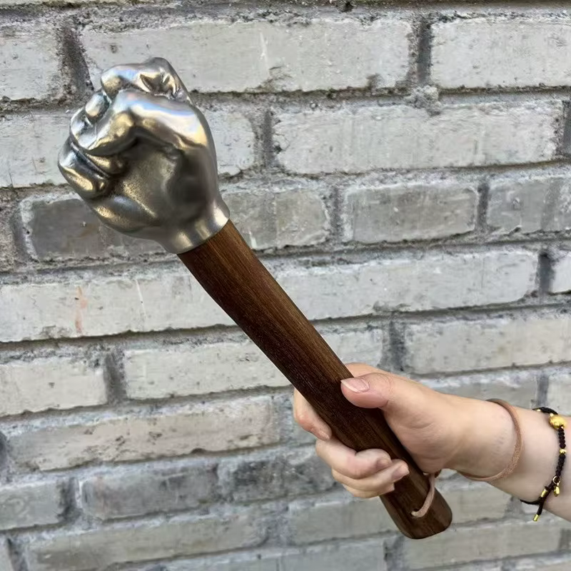 Tête de marteau à poing solide