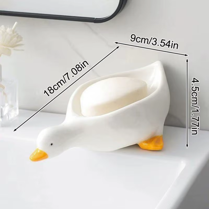 Support à savon auto-drainant en forme de canard