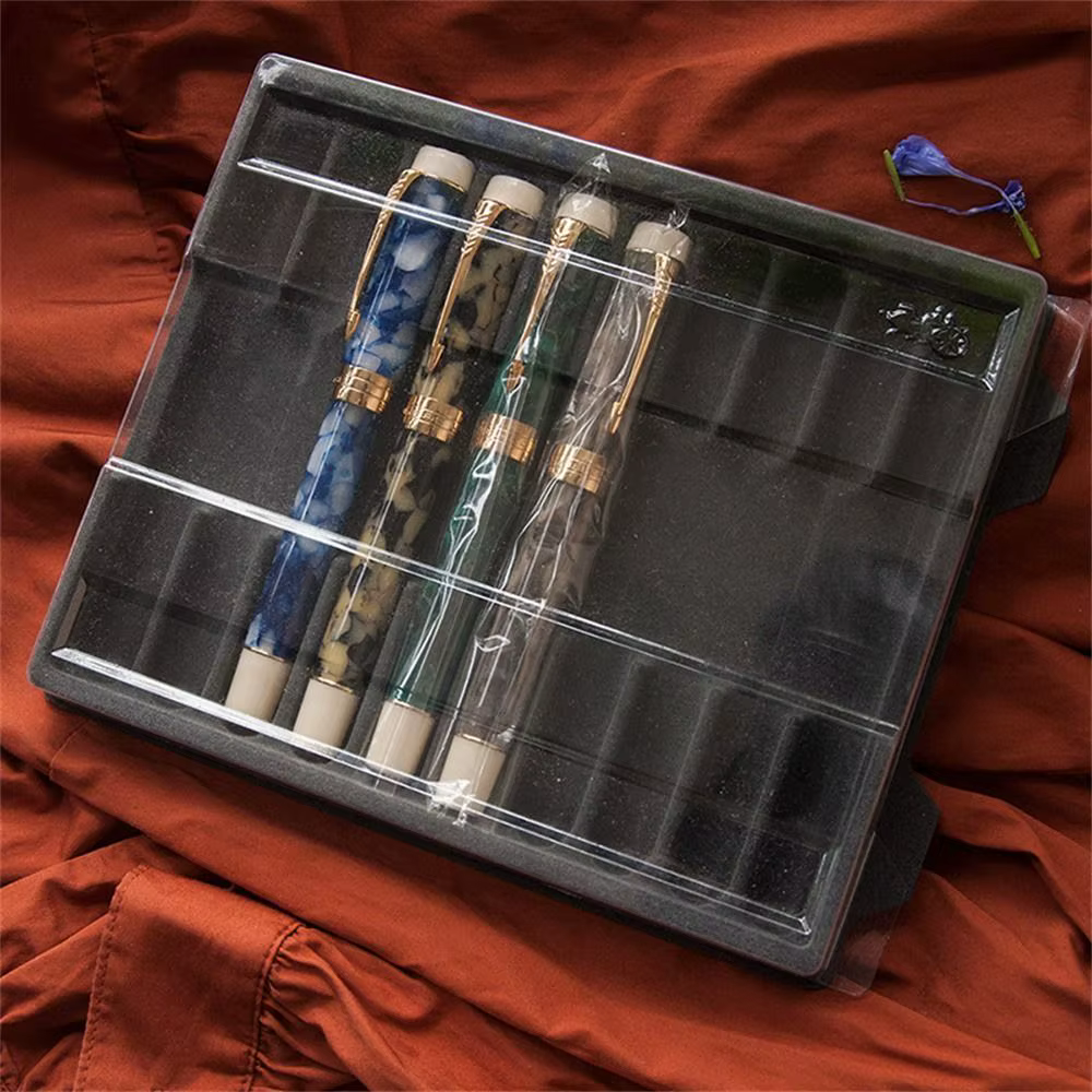 Boîte à stylos à plume transparente