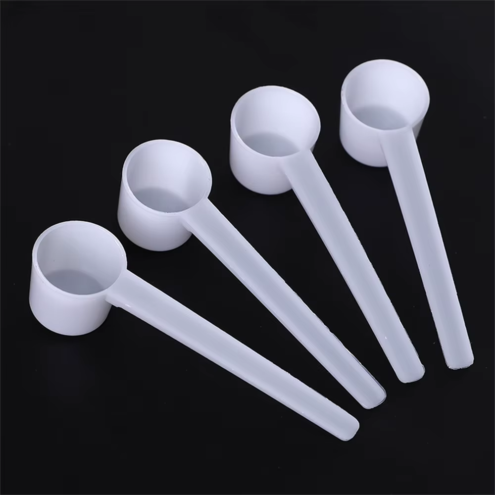 Cuillère doseuse en plastique pour café