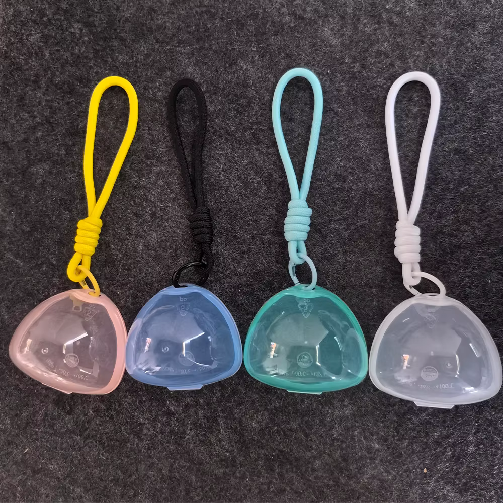 Boîte de rangement multifonctionnelle pour sucettes et bâtonnets de dentition avec cordon