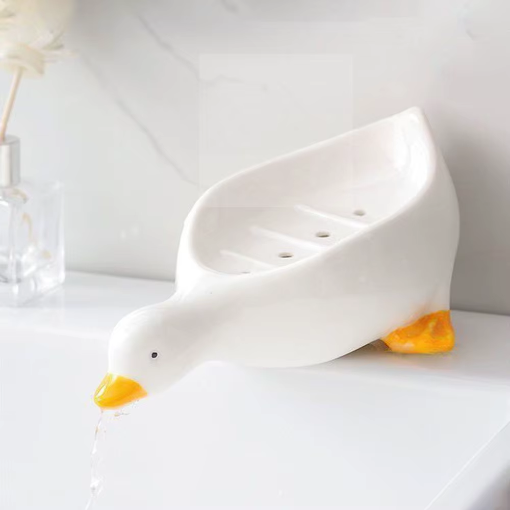 Support à savon auto-drainant en forme de canard
