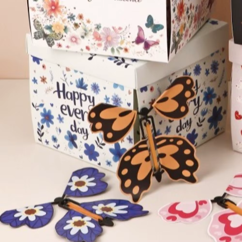 Boîte cadeau papillon multicolore à mécanisme d'explosion automatique