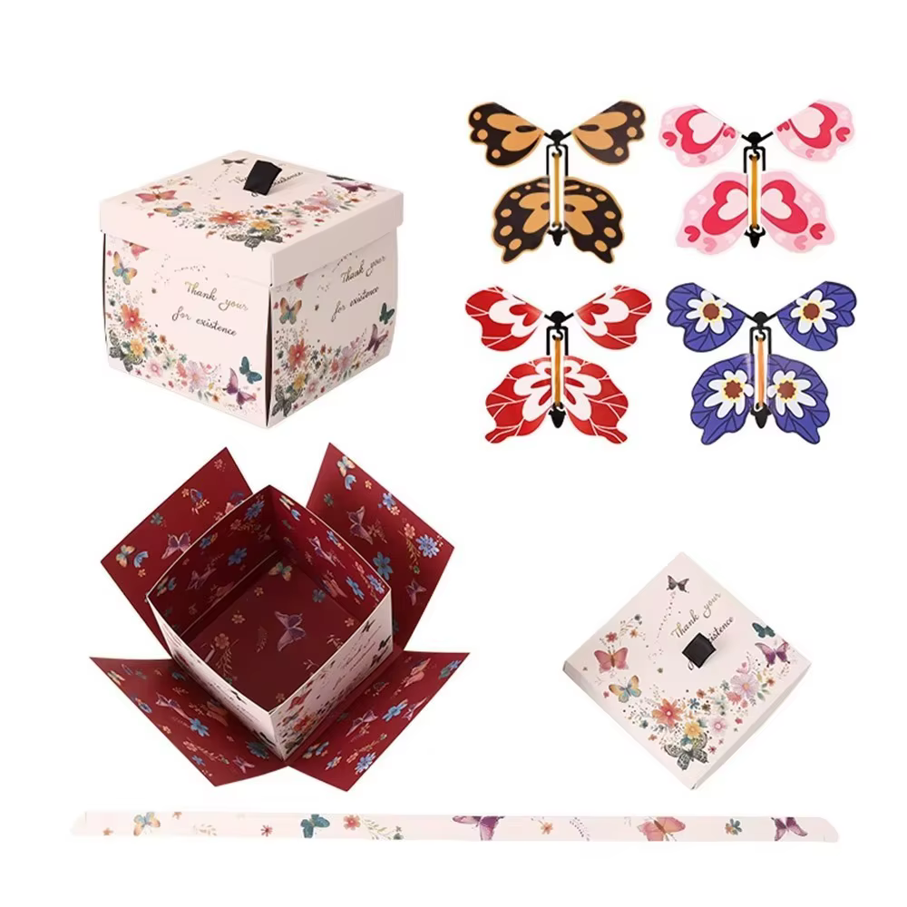 Boîte cadeau papillon multicolore avec mécanisme à remonter