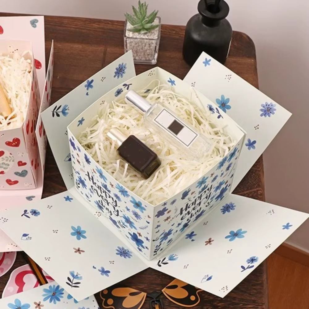 Boîte cadeau papillon multicolore avec mécanisme à remonter